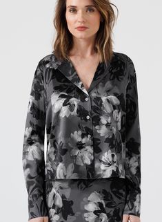 Inject some fun into your wardrobe with our Up In Smoke Floral Print Blouse. This black and white silk blouse features a playful floral print and long sleeves for a versatile look. White Silk Blouse, Subtle Luxury, Short Loungewear, Blouse Sale, Shell Buttons, Silk Charmeuse, Sweaters Online, Floral Print Blouses, White Silk