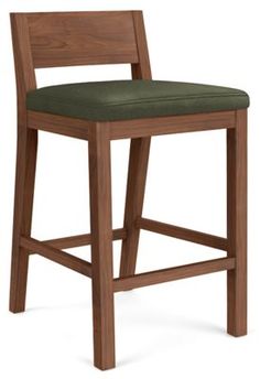 a wooden bar stool with a green upholstered seat and back cushion on an isolated white background