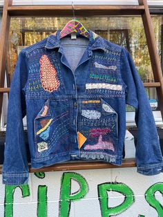 Bespoke blue jean jacket; stitched, patched; flip back pockets; cotton denim; button front.   16 inches shoulder to shoulder, 36 inch bust, 22 inches shoulder to hem, 23 inch sleeve Look dynamite - be cool on a cool night out! One of a kind.  NO RETURNS.  Thank you for visiting Tripp's Store.  You are so warm and yet so cool! Cool Night, Embellished Denim Jacket, Chapel Hill Nc, Blue Jean Jacket, Embellished Denim, Chapel Hill, Blue Jean, Wearable Art, Jean Jacket