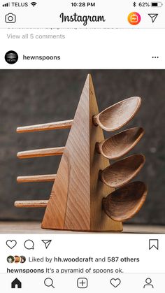 wooden spoons stacked on top of each other in the shape of an upside down tree