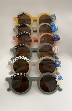 Adorable custom sunglasses for boys. Personalize these with white or black beads with names or slogans and an embellishment of your choice. All items are made to order especially for you. Details: 🦖Customize with letters in the personalization box and which color beads you would like (white or black) 🦖Choose your Charm, the fun part! 🦖Suited for Ages 0-7 year olds 🦖Fast shipping! Each item is customized and will be ready to ship in 1-3 days. If it is a rush order, please contact me beforehan Simple Sunglasses, Beaded Sunglasses, Bulk Party Favors, Boys Sunglasses, Personalized Sunglasses, Custom Sunglasses, Birthday Themes, Color Beads, Business Idea