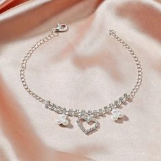 ✦ Add some sparkle to your summer look with our Dainty Rhinestone Silver Anklet Chain. This beautiful ankle bracelet features a delicate silver chain adorned with sparkling rhinestones, giving you a simple yet elegant look. Perfect for any occasion, this satellite anklet is both glamorous and versatile, making it a great addition to your summer jewelry collection. Crafted with high-quality materials, this anklet is both durable and stylish. Whether you're wearing sandals or flip-flops, this dain Rhinestone Anklet, Romantic Life, Anklet Chain, Leg Chain, Crystal Anklet, Pearl Love, Heart Anklet, Summer Anklets, Pearl Anklet