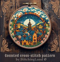 a cross - stitch pattern on a wooden background with the words, country cross - stitch pattern by stitchingland