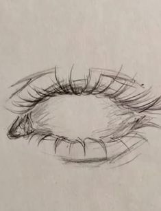 a drawing of an eye with long lashes