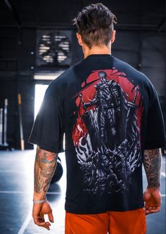 ⚔️ Inspired by the Berserk anime series and designed by Tokyo Toons, these oversized shirts (pump covers) are made from premium quality, preshrunk 230gsm fabric--medium thick with a composition of 90% cotton and 10% polyester. High-quality DTG printing ensures that the design never fades. Additionally, the tight neck-collar and drop-shoulder style create a complete look suitable for any body type.  🥷The model in the picture is 5'11" and weighs around 180lbs, wearing size M. As our shirts run sl Relaxed Fit T-shirt With Character Print For Streetwear, Black Tops With Character Print In Oversized Fit, Oversized Black Character Print Tops, Oversized Black Tops With Character Print, Oversized Black Anime Print Top, Oversized Black Top With Anime Print, Oversized Black T-shirt With Character Print, Relaxed Fit Anime Print Top For Streetwear, Oversized Graphic Gym T-shirt