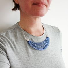 Blue with silvery shine. Seed beads bib necklace. Blue Beaded Chain Bib Necklace With Round Beads, Blue Beaded Chain Bib Necklaces, Blue Round Beaded Chain Bib Necklace, Blue Bib Necklace With Beaded Chain And Round Beads, Blue Beaded Bib Necklace With Round Beads, Blue Multi-strand Beads For Jewelry Making, Blue Multi-strand Beaded Chain, Multi-strand Blue Beads For Jewelry Making, Blue Multi-strand Necklace With Tiny Beads