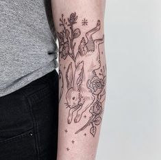 a woman with a tattoo on her arm