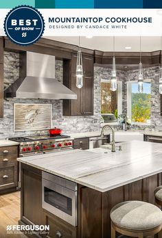 a large kitchen with an island in the middle and lots of stools around it