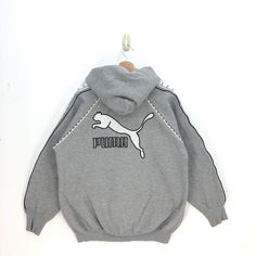 Vintage Puma Hoodie Sweater Big Logo Puma Sweatshirt Hooded | BS19922.  Tag: Puma.  Manual Measurement (Laying Flat):  Chest Armpit to Armpit: 24 Inch.  Length: 26 Inch.  (Please compare this measurement with your favorite shirt.)  No Stain, No Hole.  Fabric Material: 100% Cotton.  In good Condition overall.   BS19922.  We do combine shipping.  Please Read Before Purchase. Drop your phone number. Tracking number can be tracked 3 - 5 days after shipment process. Please be patient waiting. This de Casual Puma Logo Long Sleeve Hoodie, Casual Puma Logo Sweatshirt For Winter, Sporty Puma Logo Hoodie For Streetwear, Sporty Puma Logo Sweatshirt For Winter, Casual Long Sleeve Hoodie With Puma Logo, Casual Puma Hoodie For Sports, Casual Puma Sports Hoodie, Winter Sporty Puma Logo Sweatshirt, Casual Long Sleeve Puma Hoodie