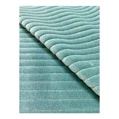 a blue rug with wavy lines on it