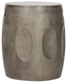 a gray vase with two circles on it