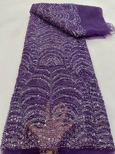 This high quality Fabric is measured in 5 Yards With Embroidered Beading and Sequin. It is soft, very delicate and beautiful. This high Quality Fabric is made with Fashion embroidered rhinestones can be used in making party wedding dresses, skirts, shawls, scarves and other other fashion apparels as you would like. Size : Length : 5 yards (180 inch). Width: 50 inch (Please allow slight deviation for the measurement data ,±1 inch) Material: 100% Polyester, Tulle Lace Fabric, Eco-Friendly embroide Beaded Party Dress, Beaded Tulle, Pretty Beads, Popular Dresses, African Beads, Purple Lace, Sequins Embroidery, Tulle Lace, African Fabric