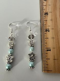 Silver Adjustable Flower Earrings For Summer, Turquoise Dangle Jewelry For Spring, Silver Dangling Beads Earrings For Summer, Summer Silver Earrings With Dangling Beads, Turquoise Dangle Earrings For Spring, Silver Beaded Earrings For Summer Gifts, Summer Silver Beaded Earrings For Gift, Spring Turquoise Flower Earrings, Silver Flower Beaded Earrings As Gift