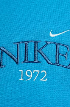 the nike logo is shown on a blue shirt