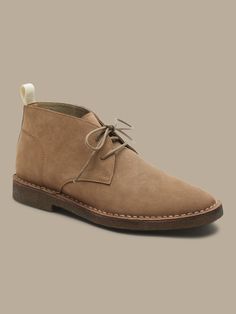 Timeless luxury, our classic desert-style chukka boot is built for exploration with a buttery soft crepe sole.  Designed with lightweight, durable OrthoLite® performance insoles for breathable cushioning that wicks away moisture for the ultimate in Outdoor Desert Boots With Rubber Sole And Plain Toe, Plain Toe Desert Boots With Rubber Sole For Outdoor, Casual Beige Desert Boots With Rubber Sole, Rugged Desert Boots With Rubber Sole For Walking, Beige Suede High-top Desert Boots, Beige High-top Suede Desert Boots, Beige Lace-up Desert Boots With Suede Lining, Casual Beige Ankle Desert Boots, Casual High-top Chukka Boots With Cushioned Footbed