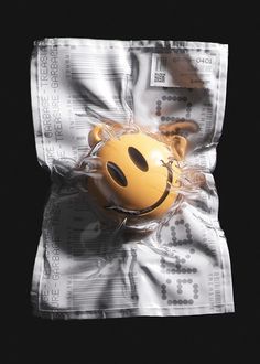 a smiley face mask wrapped in plastic