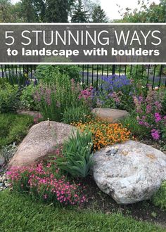 a garden with rocks and flowers in it