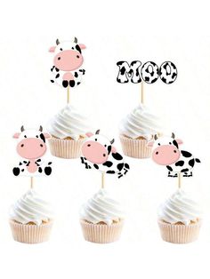 cupcakes with frosting in the shape of cows are arranged on top of each other