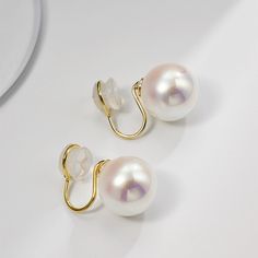 Pearl stud earrings for both pierced and non-pierced ears Coming with 12-16mm pearls, this pearl earrings stud is made of large faux pearls which have a thick luster even than normal real pearls. The pearl stud earrings are available in two types of backs: pin backs and clip-on backs. The pin backs of large pearl stud earrings are made of sterling silver which well protects pierced ears from irritations and allergies. For those who have non pierced ears, the clip on pearl earrings will properly White Pearl Clip-on Earrings, White Pearl Drop Clip-on Earrings, Pearl White Clip-on Earrings With Pearl Drop For Gift, Pearl Clip-on Earrings As Gift, Round Clip-on Pearl Earrings, Large Pearl Earrings, Real Pearls, Earrings Stud, Large Earrings