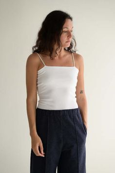 Ribbed tube top with spaghetti straps.    96% cotton 4% poly.    one size.  made in japan. Cotton Stretch Camisole With Spaghetti Straps, Fitted Cotton Tank Top With Spaghetti Straps, Seamless Fitted Cotton Tank Top, Casual Stretch Tube Top With Spaghetti Straps, Cotton Spaghetti Strap Tank Top With Stretch, Stretch Cotton Tops With Adjustable Straps, Everyday Cotton Camisole, Seamless Cotton Spaghetti Strap Tops, Everyday Cotton Camisole With Spaghetti Straps