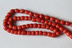 -Antique 14k Gold Natural Dark Orange Coral Beaded Necklace -Total length: 18.75 in -Bead size: about 6 mm x 5 mm -Spacer size: 2 mm -Total weight: 19.6 g -Tested 14k -Beads are barrel shape Scarab Bracelet, Coral Beads Necklace, Coral Design, Gold Vases, Vase Shapes, Orange Coral, Coral Earrings, Natural Coral, City New York