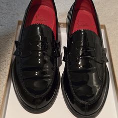 Unisex Red Bottom No Penny Loafer Is Traditional Penny Loafer Style That Has A Serrated Tongue And Is Crafted In Black Patent And Lined In Iconic Loubi Red. A Delicate Maison Christian Louboutin Style With A Cl Monogram On The Heel. Worn Once,Pristine Condition Super Soft And Comfy. Retail $945. Price Drop To $650 Luxury Loafers With Red Sole For Work, Classic Tassel Loafers With Red Sole, Designer Black Tassel Loafers For Office, Designer Black Loafers With Brogue Detailing, Formal Patent Leather Loafers With Red Sole, Elegant Patent Leather Loafers With Red Sole, Designer Patent Leather Loafers With Rubber Sole, Luxury Wingtip Loafers With Red Sole, Elegant Loafers With Red Sole And Flat Heel