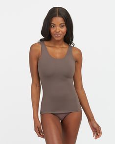 Your go-to essential and everyday layering piece, our SPANXsmooth™ Socialight Tank delivers lightweight compression for all-day wear. A tank top made from super-soft microfiber that's comfortable, breathable and quick-drying, and engineered with no-dig adjustable straps, it's the perfect smoothing shapewear base underneath any of your tops. | Spanx Women's SPANXsmooth Socialight Tank Top Full Coverage Fitted Top With Soft Touch, Fitted Tops With Soft Touch, Fitted Full Coverage Top With Soft Touch, Fitted Sleeveless Tops With Soft Touch, Fitted Sleeveless Soft Touch Top, Compressive Seamless Shapewear Top, Fitted Tank Top With Seamless Construction, Fitted Full Coverage Tank Top With Seamless Construction, Stretch Sleeveless Tops With Soft Touch