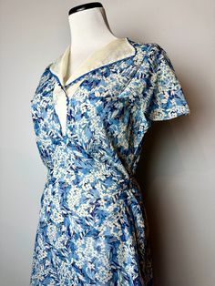 Very lovely 1920's sheer cotton dress. A pretty blue & white floral print with a sheer semi-structured voile type collar. The sleeves are very sweet, fluttery style. It has 2 long ties on each side which wrap around and tie in the back.  This is a very generous size for its era. And it does have a simple side opening at one side of the waist. Please do still consider when looking over the measurements. You may need a little extra room to slip this over your head and wiggle it down.  This dress h Thirties Fashion, Floral Dress Blue, Great Gatsby Style, Cotton Floral Dress, Great Gatsby Fashion, Floral Cotton Dress, Gatsby Style, 1920s Art, 1920s Art Deco