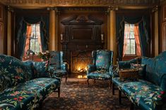 a living room filled with blue couches and chairs in front of a fire place