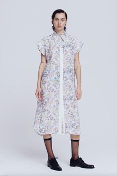 This luxe sleeveless shirtdress boasts a confident silhouette with extended shoulders and front and back yoke seams. It has a beautifully shaped collar bringing a playful softness to the overall look. The style has a concealed button front opening with contrast placket and pearl feature button. Available in a luxurious Stone coloured sandwashed silk, as well as our bespoke Wildflower print on linen. Regular fit silhouette. Model is wearing a Size 8 AU CARE INSTRUCTIONS Main: Linen Trim: Cotton W Wildflower Print, Garment Care Labels, Shirtdress, Front Open, Stone Color, Wild Flowers, Bespoke, Care Instructions, High Neck Dress