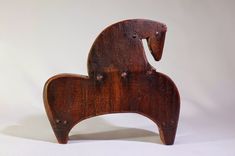 an old wooden toy horse on a white background