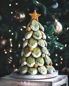 a christmas tree made out of cookies sitting on top of a table