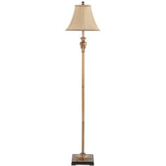 a floor lamp with a beige shade on it