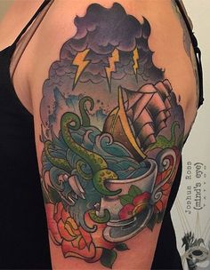 a woman's arm with an octopus and coffee cup tattoo on her left shoulder