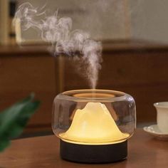 a humidifier sitting on top of a wooden table