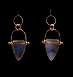 Introducing our exquisite Labradorite Drop Earrings, meticulously crafted with 14kt yellow gold. These earrings will become your new go-to accessory, featuring mesmerizing labradorite stones that shimmer with iridescent hues of blue. Perfect for adding a touch of magic to every day or into the evening, they are sure to become a cherished addition to your jewelry collection. Elegant Labradorite Jewelry For Pierced Ears, Unique Labradorite Drop Earrings, Gold Labradorite Earrings With Natural Stones, Blue Gemstone Labradorite Earrings, Hand Forged Labradorite Dangle Earrings, Blue Labradorite Gemstone Earrings, Unique Labradorite Drop Earrings Jewelry, Labradorite Stone, Labradorite