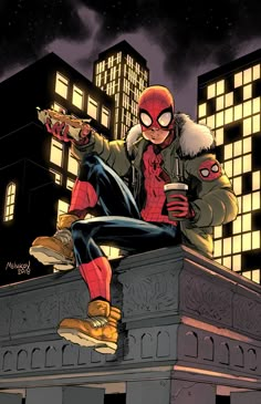 a spider - man sitting on top of a building