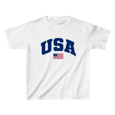 The USA Baby Tee is a must-have for any trendy woman's wardrobe. Featuring a y2k graphic print, this women's baby tee proudly displays your love for America. Made from high-quality materials, the USA Baby Tee offers both style and comfort. Represent your country with this chic and stylish top. Summer Streetwear T-shirt With School Spirit, 4th Of July Cotton T-shirt With Text Print, Short Sleeve Tops For School Spirit Streetwear, 4th Of July Streetwear T-shirt With Letter Print, Trendy Pre-shrunk Tops For 4th Of July, School Spirit Graphic Print T-shirt For Streetwear, White Slogan T-shirt For College, Graphic Tee With Slogan For College, College Graphic Tee With Slogan