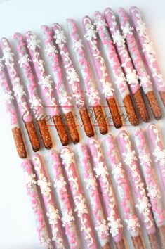 there are many pink and white candy sticks