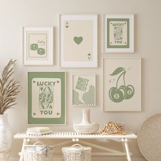 a white table topped with pictures and vases