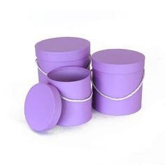 four purple containers are stacked on top of each other and one has a rope around the lid