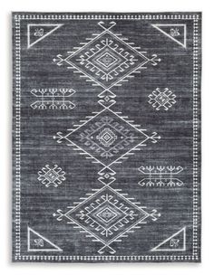 a black and white rug with an intricate design