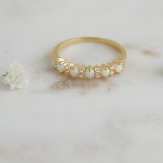 Delicate opal ring, that is perfect for stacking or wearing alone. A true beauty and must have! Sweet, simple, and dainty ring. Perfect for a minimalist look. ☆ Details ☆ * Made of 925 Sterling Silver * Available in 14k Gold Plating, Rose Gold Plating or Rhodium Plated * We use a THICK, DURABLE 14k GOLD plating - for a piece that will last you years to come! * VERY HIGH QUALITY * Available in sizes 4, 5, 6, 7, 8, 9, or 10 ✈️READY TO SHIP! Ships out same day, for quick delivery. Domestic Orders a White Opal Stackable Rings For Promise, White Opal Stackable Promise Rings, Gold Opal Stackable Rings For Wedding, Delicate Adjustable Opal Wedding Ring, Delicate Stackable Opal Ring For Wedding, Dainty Stackable Opal Wedding Ring, Opal Open Ring For Wedding, White Opal Crystal Ring For Wedding, Wedding Opal Open Ring Stackable