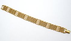 Vintage Designer Jewelry - This is a gold tone necklace and bracelet panther link set. The necklace is 16.5" long, bracelet is 7.25" long. Both pieces are slightly over .5" wide and signed Napier. Formal Gold Chain Bracelet In Brass, Formal Brass Chain Gold Bracelet, Formal Brass Gold Chain Bracelet, Formal Brass Gold Bracelet With Chain Detail, Link Jewelry, Vintage Designer Jewelry, The Necklace, Necklace And Bracelet, Gold Tone Necklace