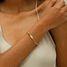 DESCRIPTION & DETAILS Anja Bracelet is a classic and statement piece meant to go solo or with any watch or bracelets. With more classy looks from its center charm design. You can never go wrong with this piece that is best paired with its collection our “Anja Collection”. Plating: 14k Gold Materials: 14K Gold on Stainless Steel, AAA Grade Freshwater Pearl Measurements: Length: 170mm+50mm﻿ Hypoallergenic SUSTAINABILITYIn-house plating - All pieces are hand crafted by our in-house jewellers ensuri Elegant Stainless Steel Chain Bracelet With Rectangular Links, Elegant Gold Bracelet With Rectangular Links In Stainless Steel, Elegant Stainless Steel Bracelets With Rectangular Links, Elegant Stainless Steel Bracelet With Rectangular Links, Elegant White Chain Bracelet, Elegant White Chain Bracelet With Solid Link, Classic White Chain Bracelet With Solid Links, Classic White Metal Chain Bracelet, Timeless Stainless Steel Chain Bracelet Gift