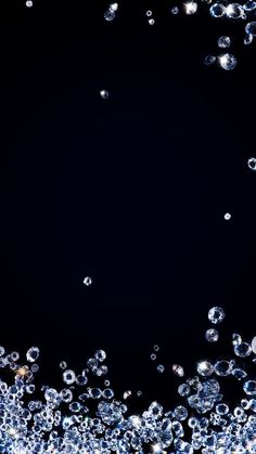 bubbles floating in the air on a black background