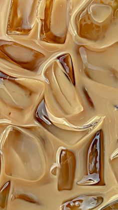 an abstract painting with lots of brown and tan colors on it's surface is shown