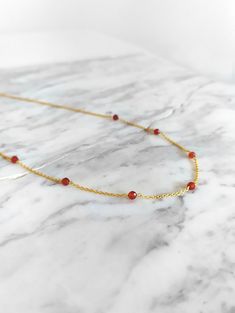 Ambrosia. Inspired by ambrosia, the food of greek gods. This necklace is composed of 14K gold vermeil delicate chain and natural carnelian gemstones. So pretty for everyday! It also makes a very cute gift! Gemstone bar is 1 inch/2,5 cm long You can choose between 4 chain lengths: 14 / 15 / 16 / 18 inches Not sure which length to buy? We can add a 1 inch extender chain. Just write a note at checkout! Other carnelian bracelet: https://www.etsy.com/listing/952670287 Similar necklace: https://www.et Delicate Charm Necklaces With Natural Stones For Gift, Delicate Charm Necklace With Natural Stones For Gifts, Delicate Natural Stones Charm Necklace For Gift, Yellow Gold Gemstone Chain Necklace Gift, Orange Necklace With Adjustable Chain As Gift, Orange Necklace With Adjustable Chain For Gift, Orange Choker Jewelry For Gift, Gemstone Pendant Chain Necklace As Gift, Dainty Orange Jewelry For Gifts