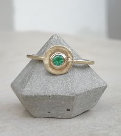 Vintage style gold ring with tiny green emerald stone 14K Gold ring Yellow gold Birthstone ring, Solid gold ring, Organic shape ring This dainty 14k Gold stackable Ring is made from 14k solid gold (you can choose 14k or 9k) it has an organic circle disc shape and features a green emerald gemstone that is bezel set in the center, Emerald is the birthstone for May, they are considered to be a symbol of rebirth and love. Delicate and minimalist, an excellent choice for anniversary gift, promise rin Green Emerald Stackable Open Rings, Green Emerald Open Ring Stackable Rings, Stackable Emerald Ring In Yellow Gold, Stackable Emerald Open Ring, 14k Gold Green Emerald Ring, Fine Jewelry 14k Gold Green Emerald Ring, 14k Gold Green Emerald Ring, Fine Jewelry, Stackable Open Emerald Ring, Minimalist Gold Emerald Birthstone Ring