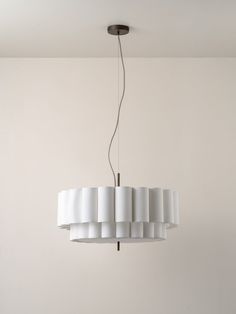 a white chandelier hanging from a ceiling